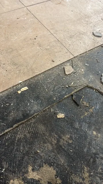 Black bitumen mastic floor removal in a W6 flat